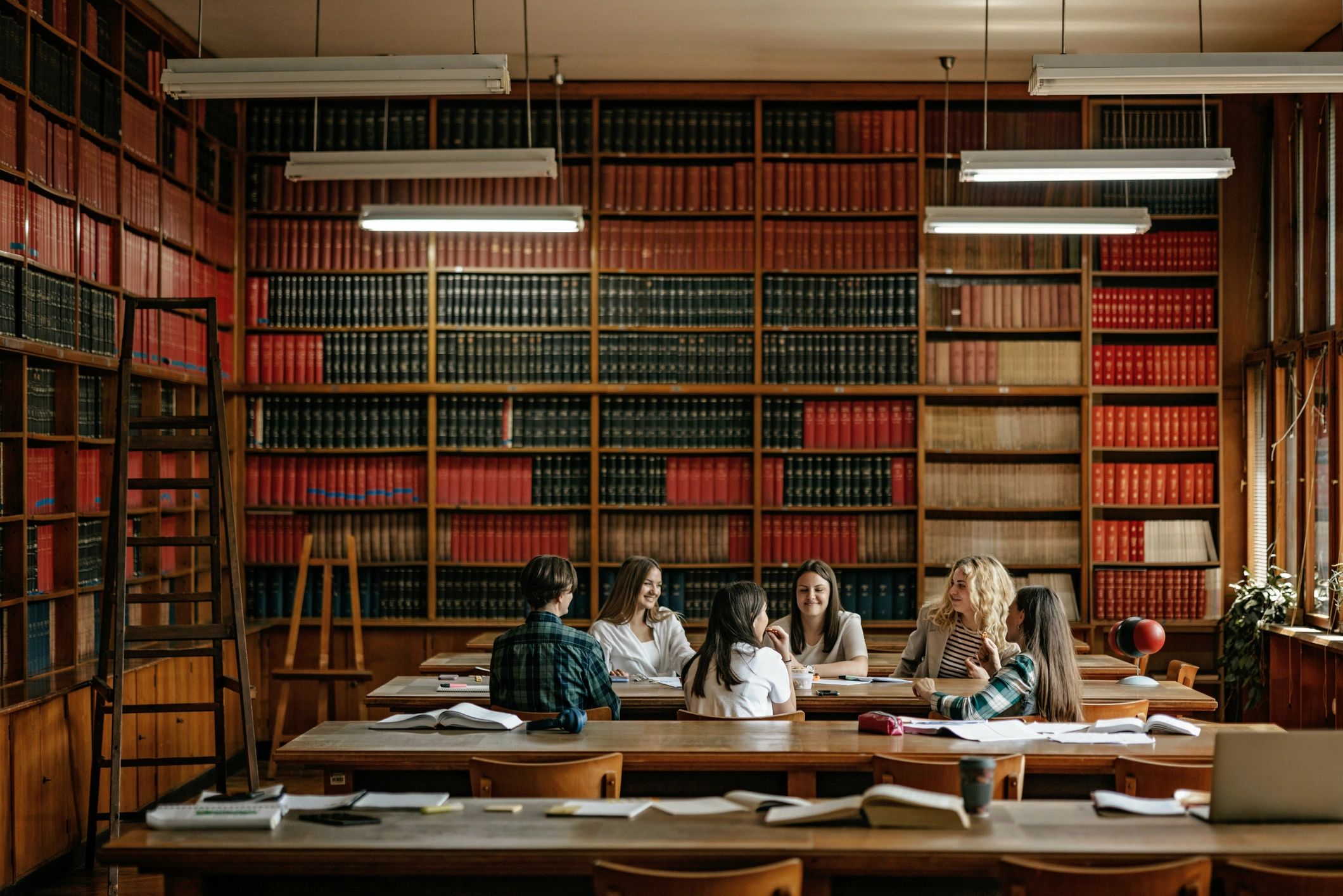 Students collaborating in a library study setting