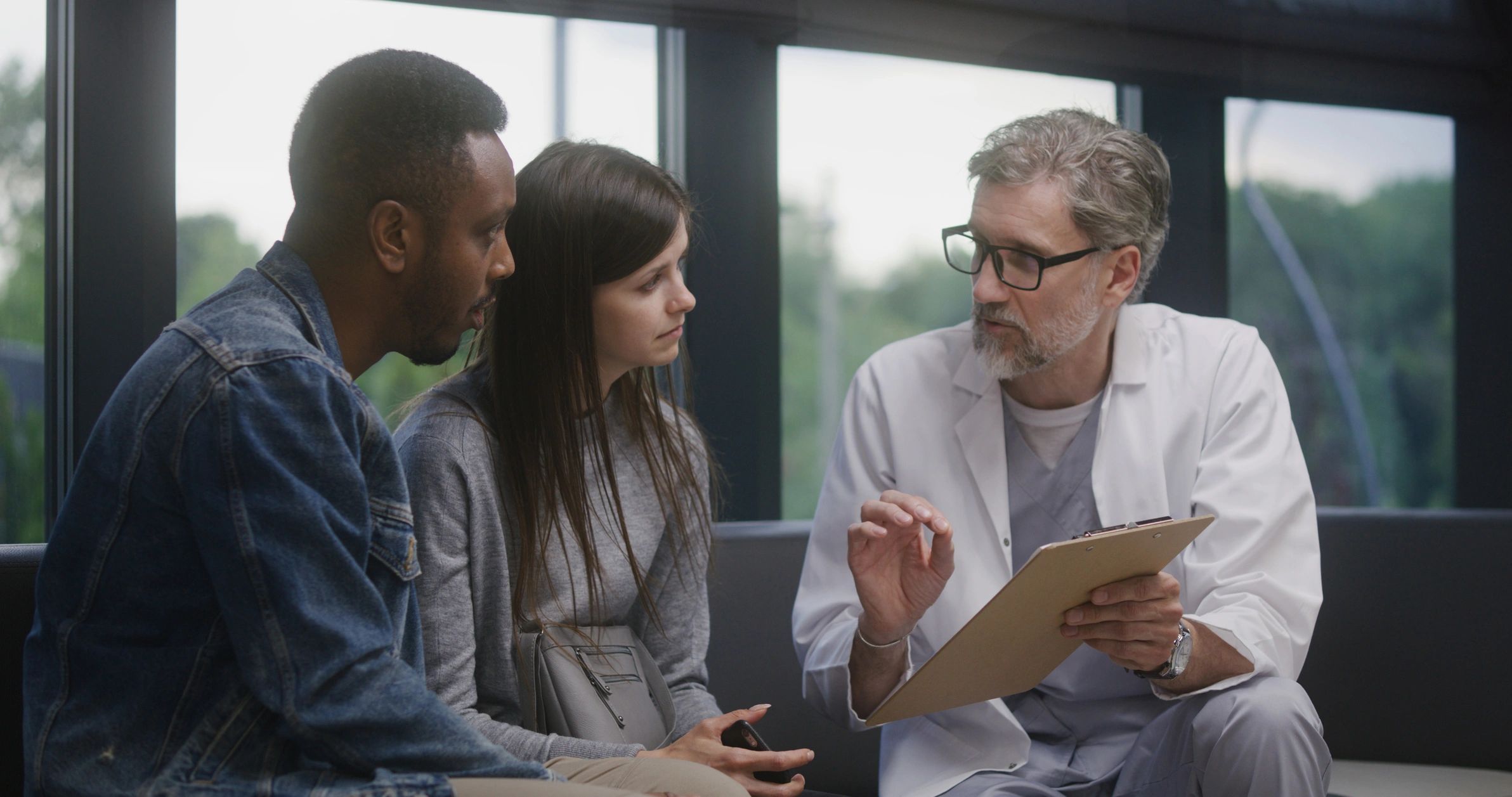 Doctor speaking with patients in clinic