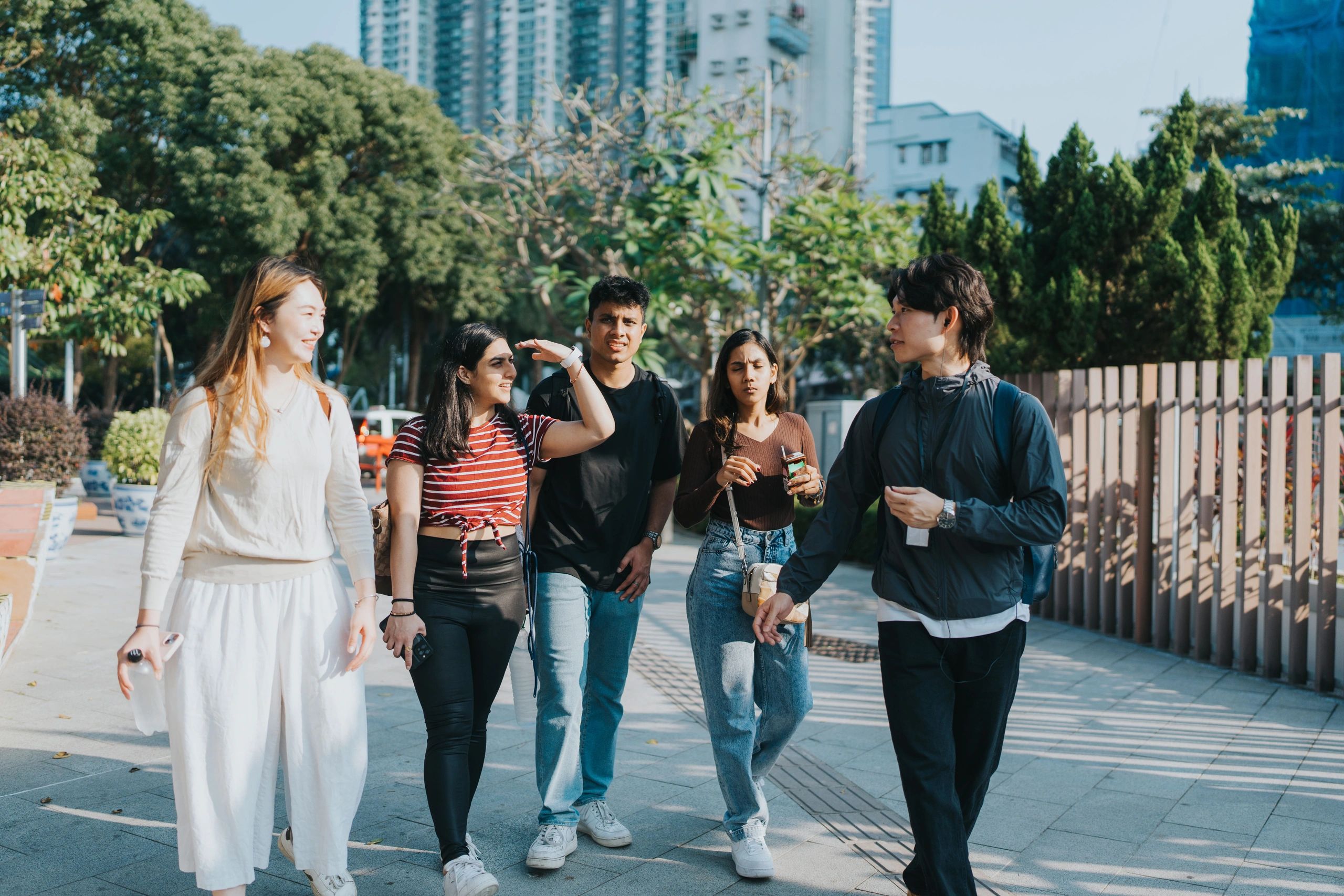 Students and guide walking together in an academic setting