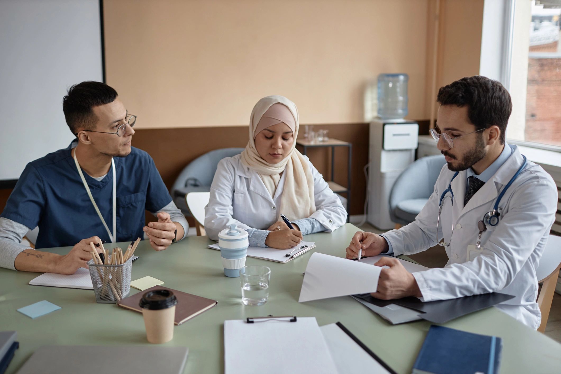 Medical faculty and trainees in discussion